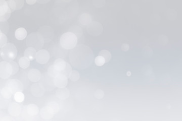 white bokeh defocus glitter blur on gray background. bokeh abstract background.