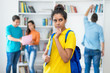 © Daniel Ernst - Thinking indian female student with group of multi ethnic students