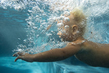 Small Baby Learning To Swim. Underwater Shooting
