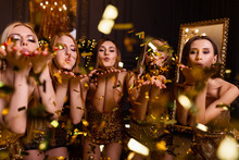 Fun Party At Girls, Bachelorette Party. New Year's Party In The Studio, Dark Background And Gold Decoration