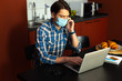 © Yakobchuk Olena - Man communicating online from home during epidemic