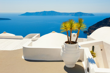 White architecture on Santorini island, Greece. Beautiful terrace with sea view. Famous travel destination