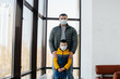 © Andrii - A father with his child stands in a mask during the quarantine. Pandemic, coronavirus