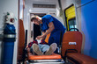 © Anna Kosolapova - A young paramedic in a uniform gives an oxygen mask to his patient