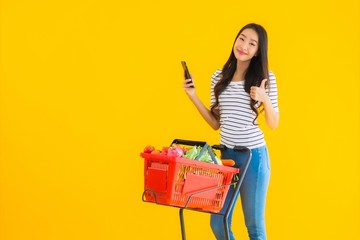 Portrait beautiful young asian woman shopping grocery from supermarket