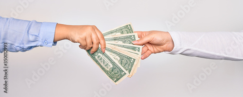 Cuadros en Lienzo Two hands of caucasian young women doing transaction