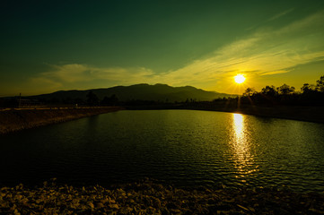 Poster - Reservoir with mountain view at sunset