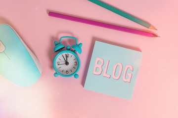 Poster - Text sign showing Blog. Business photo showcasing regularly updated website web page run by individual Alarm clock wakeup blank notepad mouse markers colored background