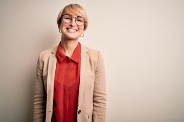 Poster - Young blonde business woman with short hair wearing glasses and elegant jacket with a happy and cool smile on face. Lucky person.