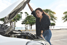 Woman And Broken Down Car On Road Checking Problem In Engine