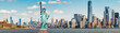 The Statue of Liberty wearing surgical mask when Covid-19 Outbreak over panorama of New york cityscape river side