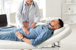 © Pixel-Shot - Gastroenterologist examining man in clinic