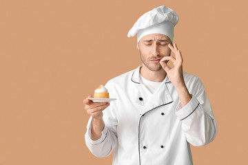 Sticker - Male confectioner with tasty dessert on color background