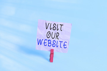 Poster - Writing note showing Visit Our Website. Business concept for visitor who arrives at web site and proceeds to browse Colored clothespin rectangle square shaped paper light blue background