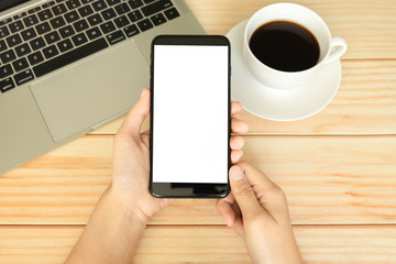 hand of women using smartphone and working in home office with coffee