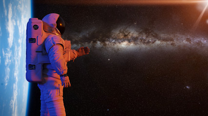 Wall Mural - astronaut presenting an empty space in front of planet earth and the milky way galaxy