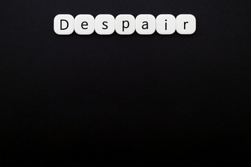 Wall Mural - Alphabet despair word block with black background.