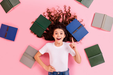 Sticker - Top view above high angle flatlay lie concept portrait of nice beautiful cheerful intelligent wavy-haired girl many different book great idea pointing up isolated over pink pastel color background