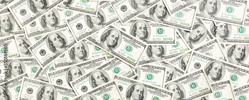 Fotomural Top view of one hundred dollar banknotes made as a background