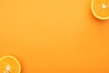 Poster - top view of juicy orange slices on colorful background