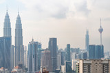 Fototapeta  - Panoramic view of Kuala Lumpur skyline at day time. City center of capital of Malaysia. Contemporary buildings exterior with glass.