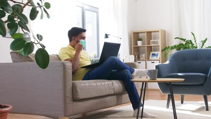 Poster - quarantine, remote job and pandemic concept - indian man wearing face protective medical mask for protection from virus disease with laptop computer working at home office