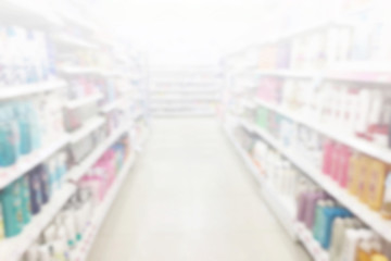  Mini mart convenience stores are a new alternative for the urban people. consumer product and skin care cream cosmetics shelf at supermarket on blur background.