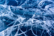 Natural Texture Of Transparent Clear Ice Of A Lake With Cracks. Many Cracks In Thick Ice. Horizontal.