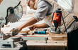 © andrew_shots - Carpenter working of manual milling machine in the carpentry