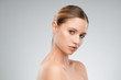 © chika_milan - Beautiful caucasian blond woman posing in studio with makeup on her face.
