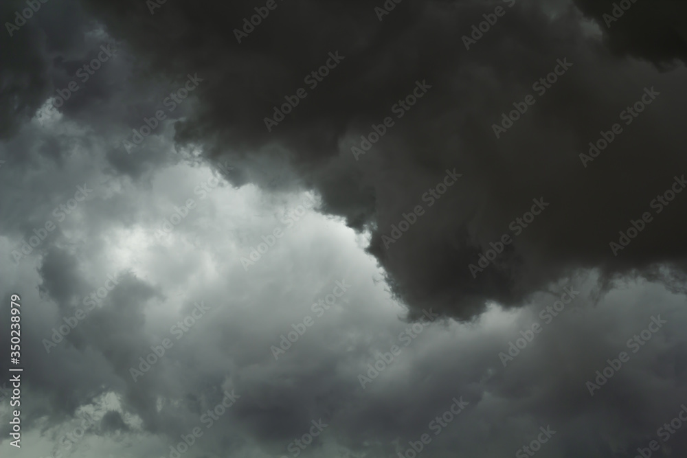 The dark sky with black clouds covered before the big storm will enter ...