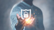 © Looker_Studio - Cyber security safe data protection business technology privacy concept. Businessman holding shield protect security icon security on the virtual display.Information security system.