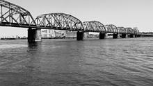 Low Angle View Of Railroad Bridge Over River
