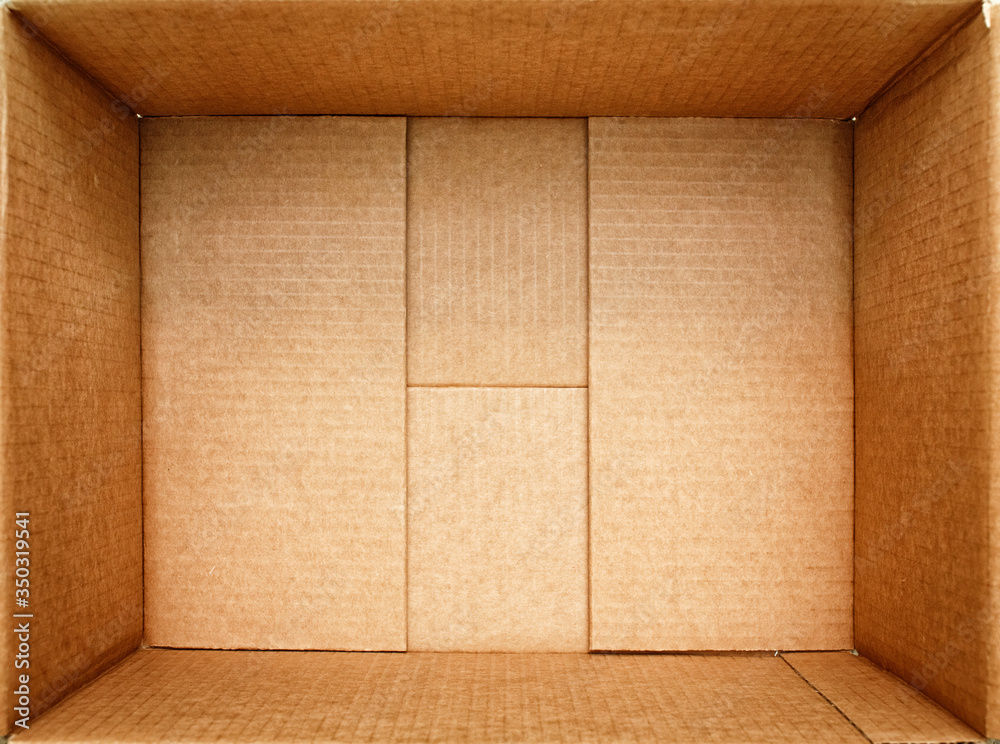 Open box for things. Empty open cardboard box close-up. Packing for cargo. - obrazy, fototapety, plakaty 