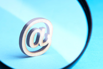 business communication mail technology concept.email symbol with magnification glass over blue background