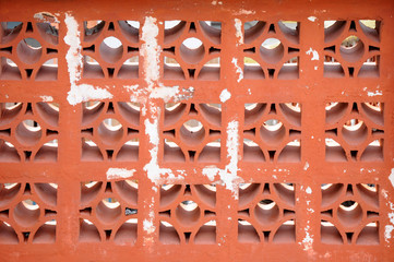 Rusty metal fence. Close-up. Carved parts