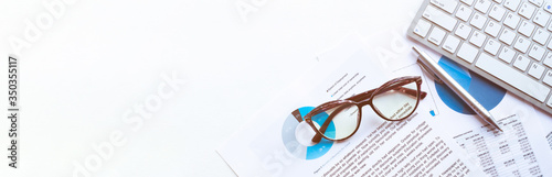 Fotografía business accounter work with taxes and keyboard on white office desk top view mo