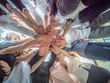 © Довидович Михаил - Friendly friends join hands as a sign of joint business. The concept of team and community.