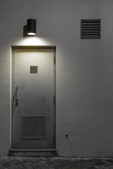 Aufkleber - Light, air vent and door on wall at night
