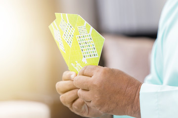 Wall Mural - Senior Muslim man holding green envelopes