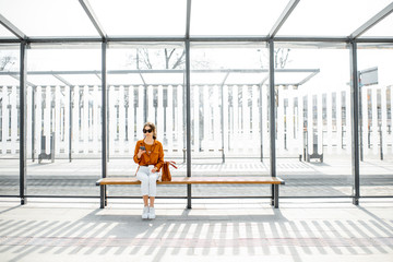 Woman at the public transport stop