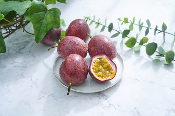 Wall Mural - The cut passion fruit was placed on a plate and shone in the sun on the windowsill