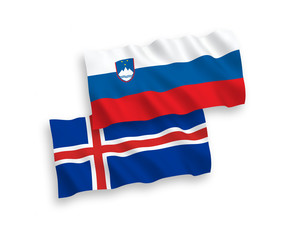 National vector fabric wave flags of Slovenia and Iceland isolated on white background. 1 to 2 proportion.