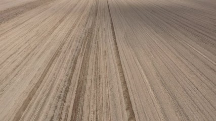 Wall Mural - Ploughing in the spring, aerial view. 

