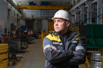 Engineer in a modern factory. The photo illustrates new technologies and production.