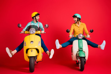 Poster - Portrait of nice attractive funky crazy comic humorous careless cheerful cheery couple driving moped without legs having fun isolated over bright vivid shine vibrant red color background