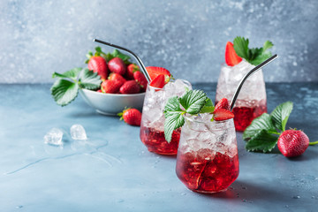 Wall Mural - Red cocktail with ice and fresh strawberry