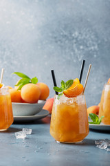 Wall Mural - Fresh apricot cocktail with ice and mint