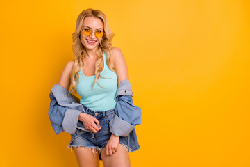 Sticker - Photo of attractive lady long curly hairdo good mood summer sunny day weekend free time wear casual turquoise singlet denim mini shorts shirt sun specs isolated yellow color background