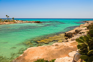 Wall Mural - Mediterranean coast with a rocky coast and turquoise sea and people